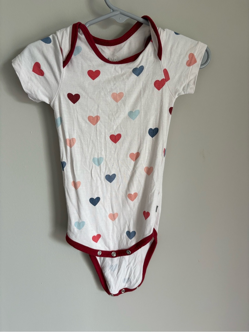 Kyte BABY White Bodysuit with Red Trim and Multi-Color Heart Print